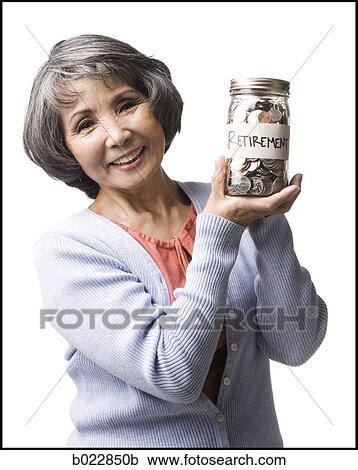 Stock Image - woman with a jar full of coins. Fotosearch