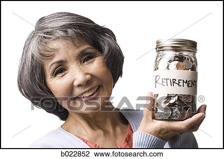 Stock Image - woman with a jar full of coins. Fotosearch