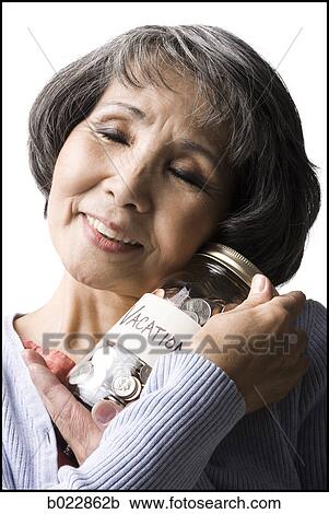 woman with a jar full of coins View Large Photo Image Stock Image - woman with a jar full of coins. Fotosearch