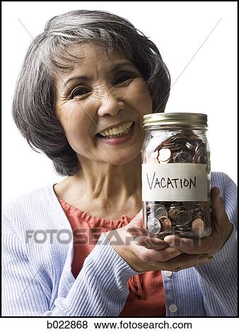 woman with a jar full of coins View Large Photo Image Stock Photo - woman with a jar full of coins. Fotosearch
