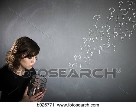 Stock Image - woman with a jar full of question marks. Fotosearch