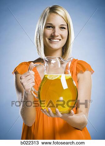 woman with a pitcher of lemonade View Large Photo Image Stock Image - woman with a pitcher of lemonade. Fotosearch