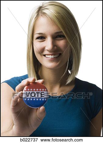 woman with a "vote" button View Large Photo Image Stock Photo - woman with a "vote" button. Fotosearch