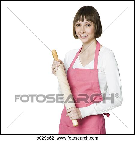 woman with an apron and a rolling pin View Large Photo Image Stock Image - woman with an apron and a rolling pin. Fotosearch