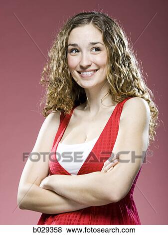 Stock Photo - woman with her arms folded. Fotosearch