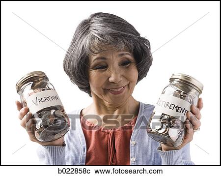 woman with two jars of coins View Large Photo Image Stock Image - woman with two jars of coins. Fotosearch
