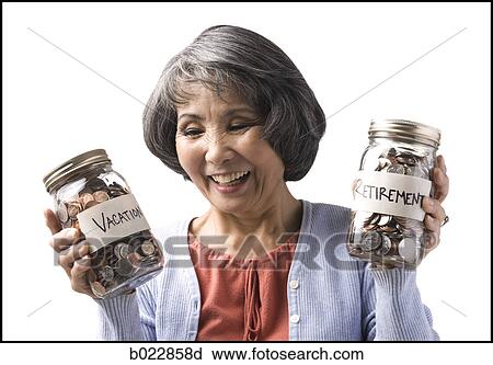 Stock Image - woman with two jars of coins. Fotosearch