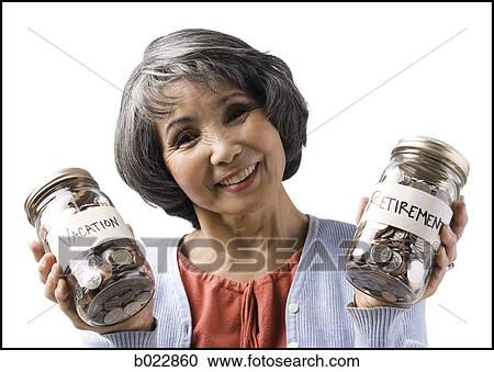 Stock Image - woman with two jars of coins. Fotosearch