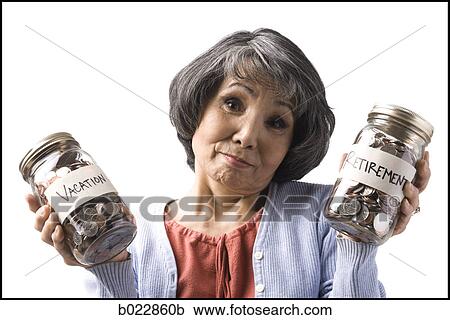 Stock Image - woman with two jars of coins. Fotosearch