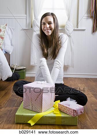 woman wrapping presents in her room View Large Photo Image Stock Image - woman wrapping presents in her room. Fotosearch