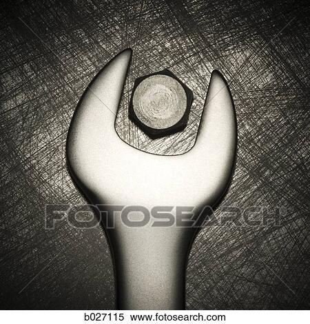 Stock Photography - wrong size wrench trying to turn a bolt. Fotosearch