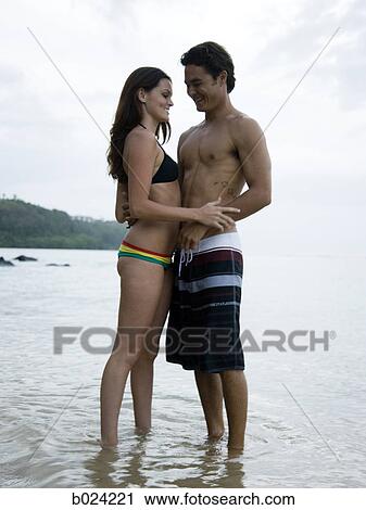 young couple at the beach View Large Photo Image Stock Image - young couple at the beach. Fotosearch