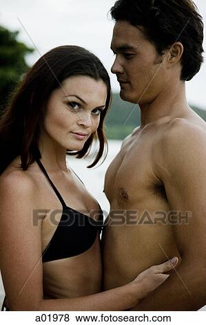 Stock Photo - young couple at the beach. Fotosearch