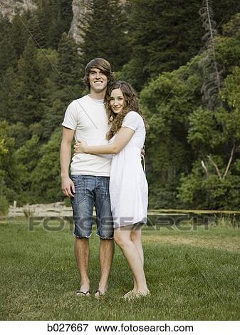 young couple by a pond View Large Photo Image Stock Photo - young couple by a pond. Fotosearch