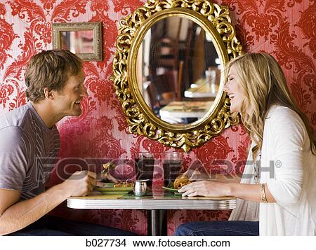 young couple eating together at a diner View Large Photo Image Picture - young couple eating together at a diner. Fotosearch