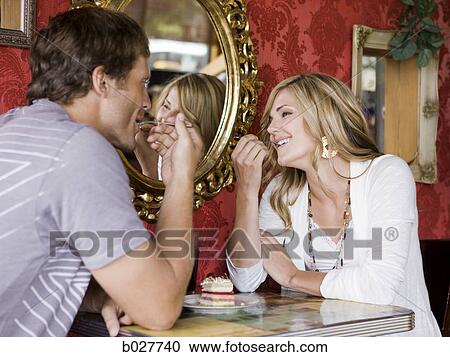 young couple eating together at a diner View Large Photo Image Stock Image - young couple eating together at a diner. Fotosearch