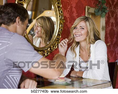 young couple eating together at a diner View Large Photo Image Stock Image - young couple eating together at a diner. Fotosearch