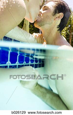 young couple in a swimming pool View Large Photo Image Stock Photo - young couple in a swimming pool. Fotosearch
