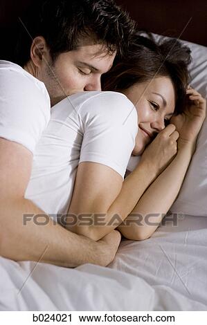 young couple in bed View Large Photo Image Stock Image - young couple in bed. Fotosearch