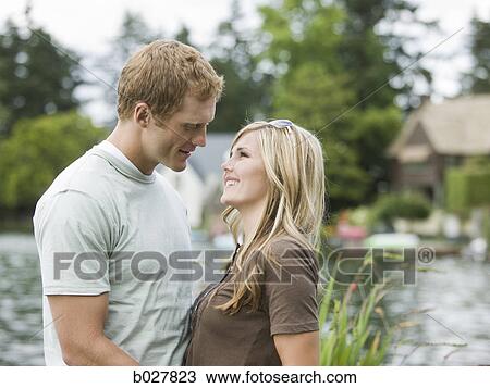 young couple in front of a lake View Large Photo Image Stock Image - young couple in front of a lake. Fotosearch