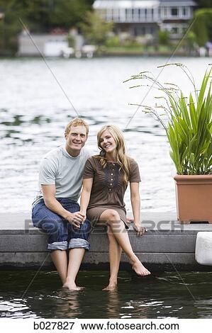 young couple in front of a lake View Large Photo Image Stock Photo - young couple in front of a lake. Fotosearch