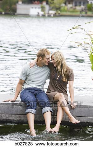 young couple in front of a lake View Large Photo Image Stock Photo - young couple in front of a lake. Fotosearch