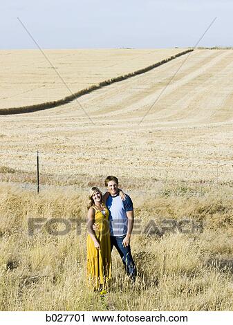 Stock Image - young couple on the side of the road. Fotosearch