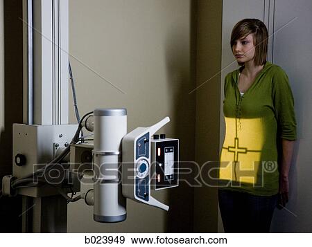 young woman having an x-ray taken View Large Photo Image Stock Photo - young woman having an x-ray taken. Fotosearch