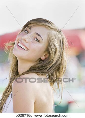 young woman in a white swimsuit View Large Photo Image Stock Image - young woman in a white swimsuit. Fotosearch