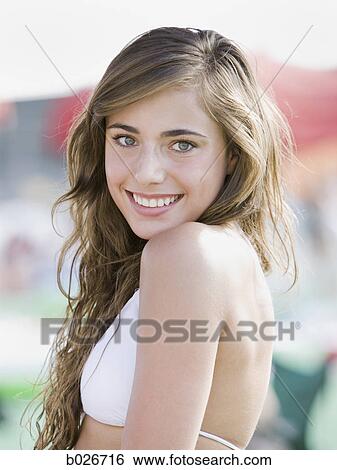 young woman in a white swimsuit View Large Photo Image Stock Photograph - young woman in a white swimsuit. Fotosearch