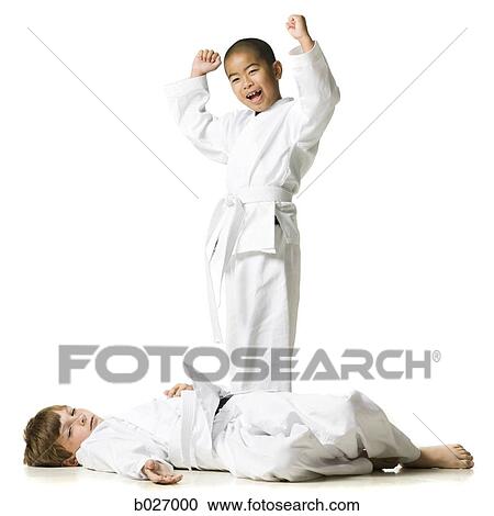 Stock Image - youth practicing martial arts. Fotosearch