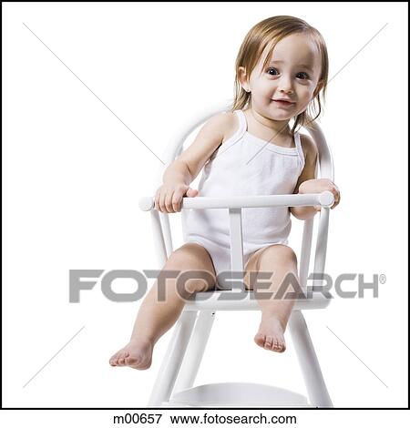 baby girl in a high chair View Large Photo Image Stock Photo - baby girl in a high chair. Fotosearch