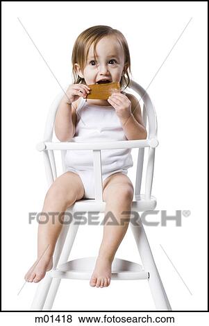 baby girl in a high chair View Large Photo Image Stock Photo - baby girl in a high chair. Fotosearch
