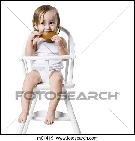 baby girl in a high chair View Large Photo Image Stock Photo - baby girl in a high chair. Fotosearch
