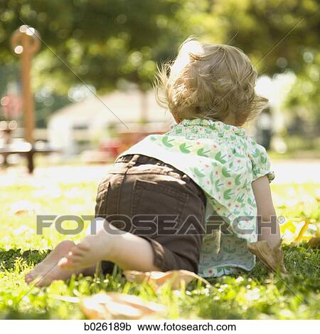 baby girl on the grass View Large Photo Image Stock Image - baby girl on the grass. Fotosearch