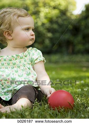 baby girl on the grass View Large Photo Image Stock Photo - baby girl on the grass. Fotosearch