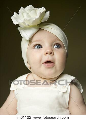 baby girl with a bow on her head View Large Photo Image Stock Image - baby girl with a bow on her head. Fotosearch