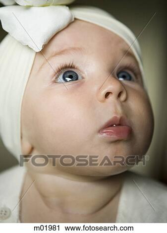baby girl with a bow on her head View Large Photo Image Stock Image - baby girl with a bow on her head. Fotosearch