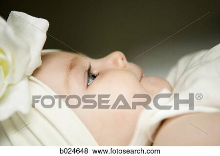 baby girl with a bow on her head View Large Photo Image Stock Photo - baby girl with a bow on her head. Fotosearch