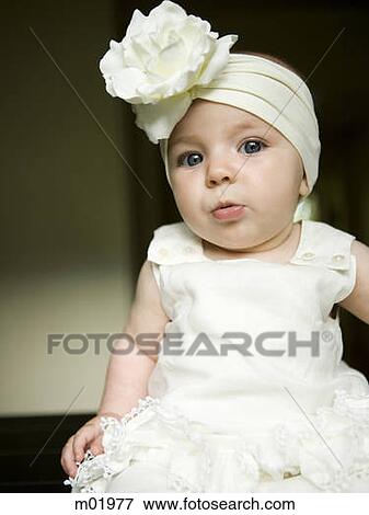 baby girl with a bow on her head View Large Photo Image Stock Photo - baby girl with a bow on her head. Fotosearch