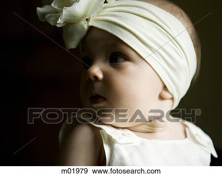 baby girl with a bow on her head View Large Photo Image Stock Photo - baby girl with a bow on her head. Fotosearch