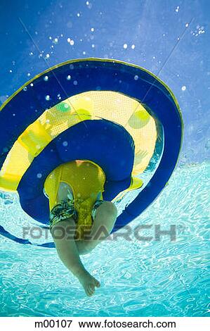 Stock Photo - baby in a swimming pool. Fotosearch