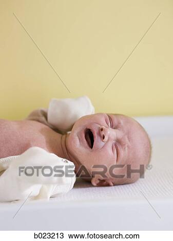 baby on a changing table View Large Photo Image Stock Image - baby on a changing table. Fotosearch