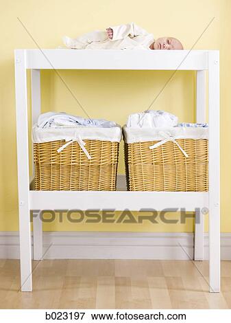 baby on a changing table View Large Photo Image Stock Photo - baby on a changing table. Fotosearch