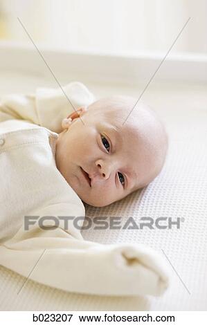 Stock Photo - baby on a changing table. Fotosearch