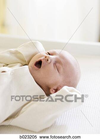 Stock Photography - baby on a changing table. Fotosearch
