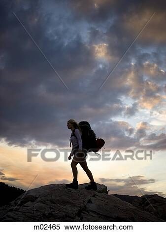 backpacker hiking through the wilderness View Large Photo Image Stock Photography - backpacker hiking through the wilderness. Fotosearch