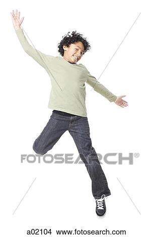Boy (8-9) jumping, against white background View Large Photo Image Picture - Boy (8-9) jumping, against white background. Fotosearch