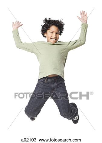 Boy (8-9) jumping, against white background View Large Photo Image Stock Image - Boy (8-9) jumping, against white background. Fotosearch