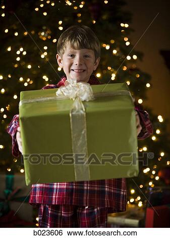 Stock Photograph - boy at christmas. Fotosearch
